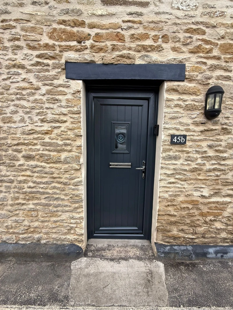 Anthracite cottage front door respray by Spray Genius in Kings Heath - stone cottage setting