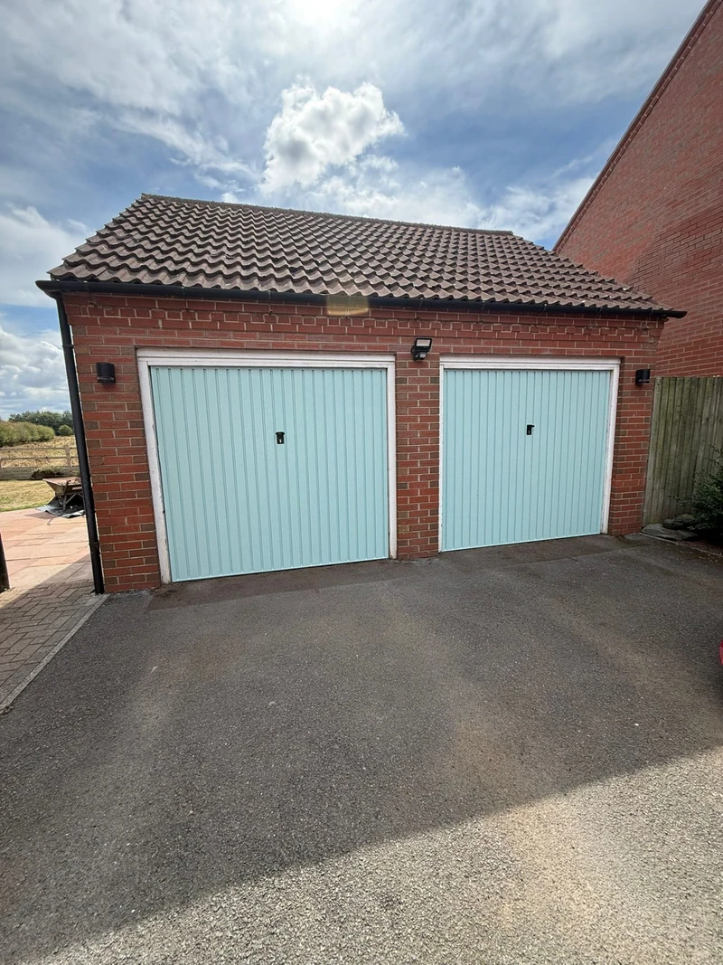 Duck egg blue double garage doors respray by Spray Genius in Tamworth