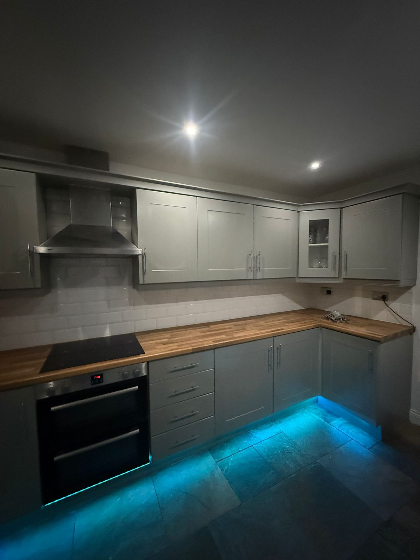 Modern grey kitchen with LED lighting