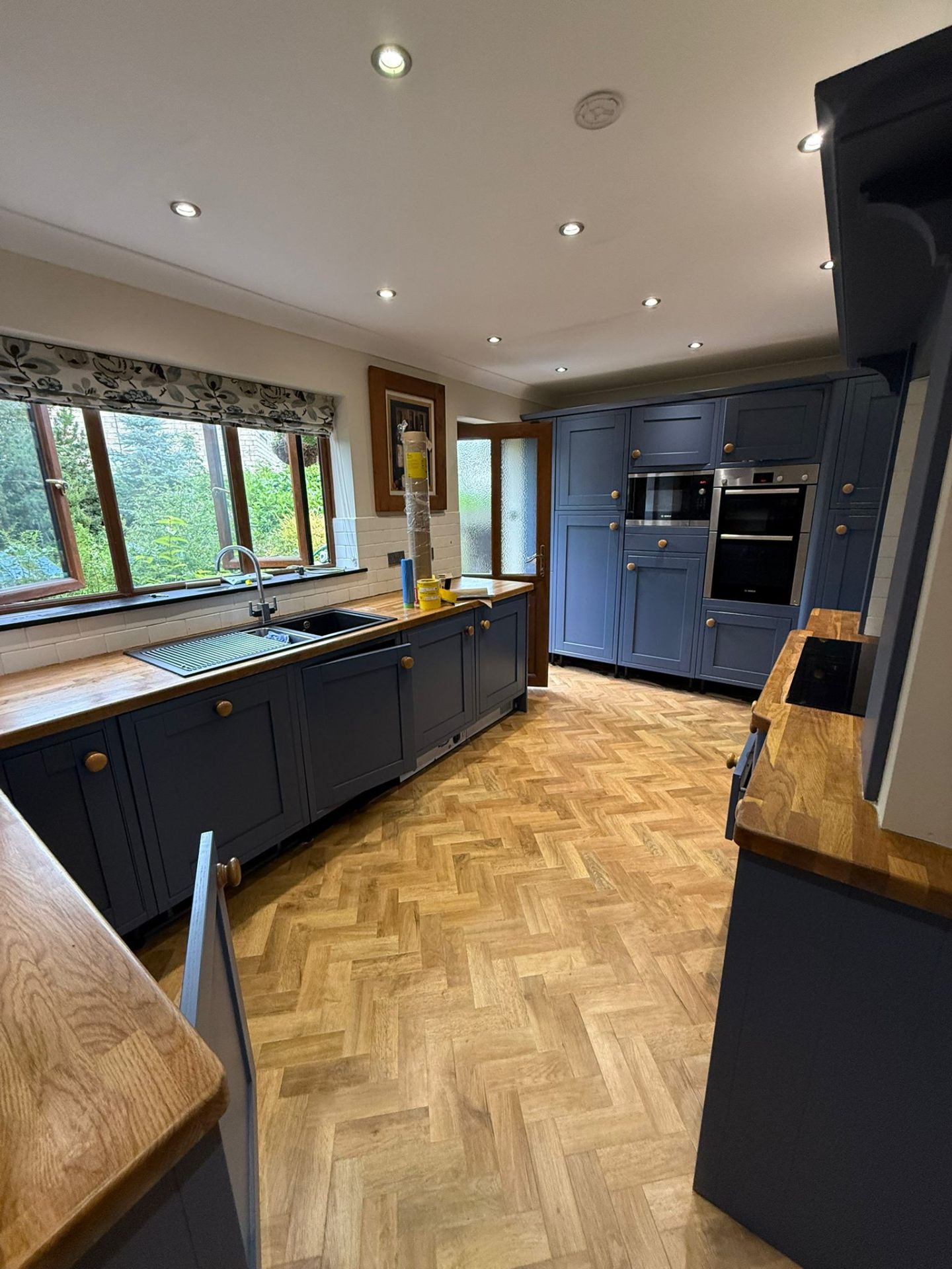 Navy herringbone kitchen cabinet respray